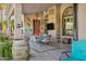 Inviting outdoor patio with a dining table, stylish decor, and a ceiling fan, ideal for al fresco dining at 26475 N Wrangler Rd, Scottsdale, AZ 85255