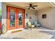 Cozy outdoor patio with comfortable seating, a ceiling fan, and stylish decor, perfect for relaxing at 26475 N Wrangler Rd, Scottsdale, AZ 85255