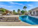 Inviting pool area with travertine steps and palm tree views at 26475 N Wrangler Rd, Scottsdale, AZ 85255
