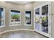 Sunroom with large windows providing views of the pool and patio area at 26475 N Wrangler Rd, Scottsdale, AZ 85255