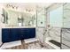 Modern bathroom featuring dual sinks, marble-tiled shower, and contemporary fixtures at 278 S San Luis Rey Trl, Casa Grande, AZ 85194