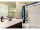 Bathroom features a white vanity, stylish fixtures, and tiled shower-tub combination at 278 S San Luis Rey Trl, Casa Grande, AZ 85194