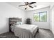 Large bedroom boasts a ceiling fan, plush carpet, and neutral paint for a relaxing feel at 278 S San Luis Rey Trl, Casa Grande, AZ 85194
