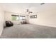 Spacious bonus room with neutral carpet, ceiling fan and double windows for natural light at 278 S San Luis Rey Trl, Casa Grande, AZ 85194