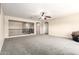Second bonus room with neutral carpet, ceiling fan and metal railing to stairs at 278 S San Luis Rey Trl, Casa Grande, AZ 85194