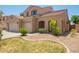 Charming home featuring a desert-landscaped front yard and attached two-car garage at 278 S San Luis Rey Trl, Casa Grande, AZ 85194