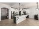 Bright, modern kitchen with white cabinets, stainless steel appliances, and a large central island at 278 S San Luis Rey Trl, Casa Grande, AZ 85194