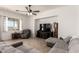 Inviting living room featuring a comfortable gray sectional sofa and tiled floors at 278 S San Luis Rey Trl, Casa Grande, AZ 85194
