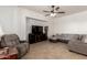 Inviting living room featuring a comfortable gray sectional sofa and tiled floors at 278 S San Luis Rey Trl, Casa Grande, AZ 85194