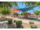 Community playground featuring multiple slides, play structures, and shade canopies offers Gathering fun in the neighborhood at 278 S San Luis Rey Trl, Casa Grande, AZ 85194