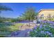 Private backyard featuring desert landscaping, rock features, and flowering shrubs at 29384 N Rosewood Dr, San Tan Valley, AZ 85143