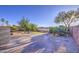 Backyard featuring rock landscaping, putting green, and desert trees at 29384 N Rosewood Dr, San Tan Valley, AZ 85143