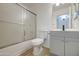 Bright bathroom features a shower, toilet, and modern white vanity with mirror at 29384 N Rosewood Dr, San Tan Valley, AZ 85143