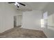 Neutral bedroom with plush carpet, a ceiling fan and natural light at 29384 N Rosewood Dr, San Tan Valley, AZ 85143