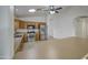 Open kitchen design with stainless steel appliances and oak cabinetry at 29384 N Rosewood Dr, San Tan Valley, AZ 85143