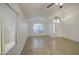 Spacious living room features tile flooring and a ceiling fan at 29384 N Rosewood Dr, San Tan Valley, AZ 85143