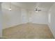 Large living room with tile flooring and bright, neutral paint at 29384 N Rosewood Dr, San Tan Valley, AZ 85143
