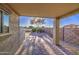 Covered patio offers outdoor living space with brick pavers and views of the backyard at 29384 N Rosewood Dr, San Tan Valley, AZ 85143