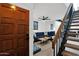 Inviting entryway with hardwood door, staircase, and view of the stylish living room at 2946 N 14Th St # 37, Phoenix, AZ 85014