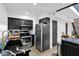 Well-lit kitchen with black cabinets, stainless steel appliances, and black countertops with white veining at 2946 N 14Th St # 37, Phoenix, AZ 85014
