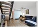 Bright living room with a comfy sofa, sleek floors, and a staircase in the background at 2946 N 14Th St # 37, Phoenix, AZ 85014