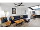 Cozy living room featuring a comfortable blue sofa, stylish decor, and bright lighting at 2946 N 14Th St # 37, Phoenix, AZ 85014