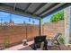 Covered patio with chairs, small table and BBQ grill at 2946 N 14Th St # 37, Phoenix, AZ 85014