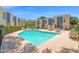 Beautiful community pool surrounded by lounge chairs and well-maintained landscaping at 2946 N 14Th St # 37, Phoenix, AZ 85014