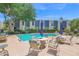 Community pool with outdoor seating in a well-maintained residential area with mature landscaping at 2946 N 14Th St # 37, Phoenix, AZ 85014