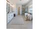 Modern bathroom with a freestanding tub, glass-enclosed shower, and a double vanity with chic fixtures at 29497 N 156Th St, Scottsdale, AZ 85262