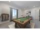 Entertain in this game room featuring a billiards table and comfortable seating area at 29587 N 156Th St, Scottsdale, AZ 85262
