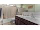 Bathroom with a sink, vanity, mirror, and a shower/tub combination with a curtain at 3026 N 305Th Dr, Buckeye, AZ 85396