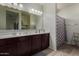 Bathroom featuring a double sink vanity, and a shower and tub combo at 3026 N 305Th Dr, Buckeye, AZ 85396
