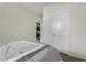Bedroom featuring a neutral color palette and a door leading to another room at 3026 N 305Th Dr, Buckeye, AZ 85396