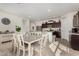 Open-concept dining area adjacent to the kitchen with stylish décor and ample space at 3026 N 305Th Dr, Buckeye, AZ 85396