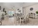 Bright dining area features a table with seating for six and sliding glass doors at 3026 N 305Th Dr, Buckeye, AZ 85396