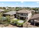 Aerial view of a tan two-story home with tile roof, fenced backyard, and desert landscaping at 4416 W Magellan Dr, New River, AZ 85087