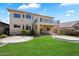 Spacious backyard with well-maintained lawn, desert landscaping, and a covered patio for outdoor enjoyment at 4416 W Magellan Dr, New River, AZ 85087