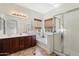 Bright bathroom with a double sink vanity, a soaking tub and glass enclosed shower at 4416 W Magellan Dr, New River, AZ 85087