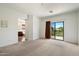 Spacious bedroom with a sliding door to a balcony offering beautiful outdoor views at 4416 W Magellan Dr, New River, AZ 85087