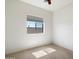 Spare bedroom featuring neutral carpeting, a window, and a modern ceiling fan at 4416 W Magellan Dr, New River, AZ 85087
