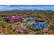 Community clubhouse and pool area with lounge seating, waterslides, and manicured landscaping at 4416 W Magellan Dr, New River, AZ 85087