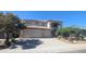 Stunning two-story home featuring a three-car garage, desert landscaping, and a welcoming facade at 4416 W Magellan Dr, New River, AZ 85087
