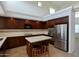 Modern kitchen featuring stainless steel appliances, light countertops, and a stylish island at 4416 W Magellan Dr, New River, AZ 85087