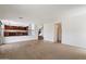Open-concept living room with tile flooring, open staircase and view to the kitchen at 4416 W Magellan Dr, New River, AZ 85087
