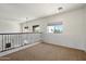Cozy loft area with carpet and large windows offering lots of natural light at 4416 W Magellan Dr, New River, AZ 85087