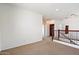 Open loft area with carpet and iron railings offering additional living space at 4416 W Magellan Dr, New River, AZ 85087