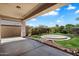 Relaxing covered patio with view of a well maintained green backyard and room for outdoor entertaining at 4416 W Magellan Dr, New River, AZ 85087