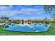 Scenic pond reflects the sky and surrounding trees, creating a serene and natural environment at 4416 W Magellan Dr, New River, AZ 85087