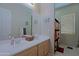 Bright bathroom with dual sinks, a large mirror, and ample counter space and cabinet space at 4609 W Challenger Trl, New River, AZ 85087